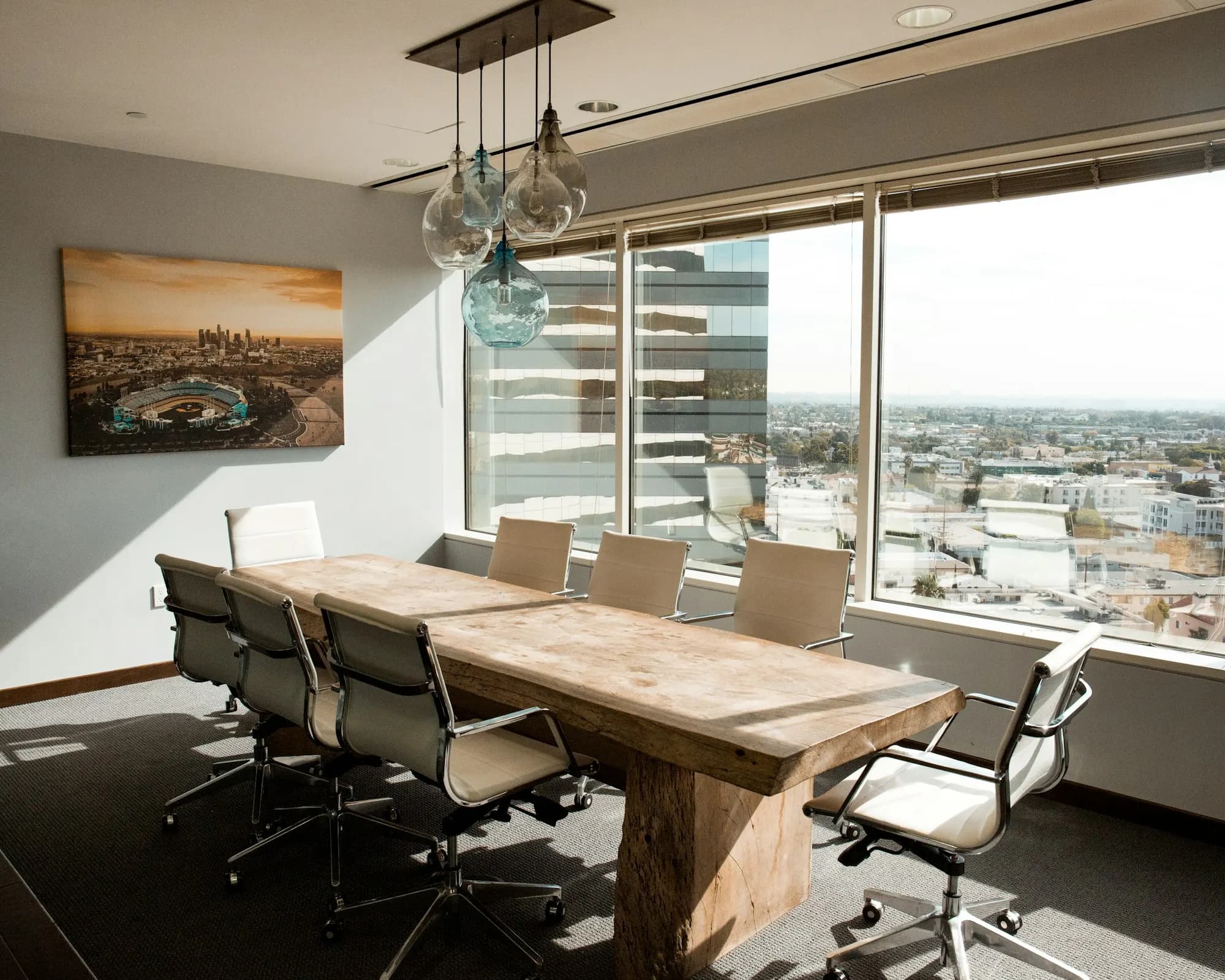 Wooden meeting table with a city view (illustrative)