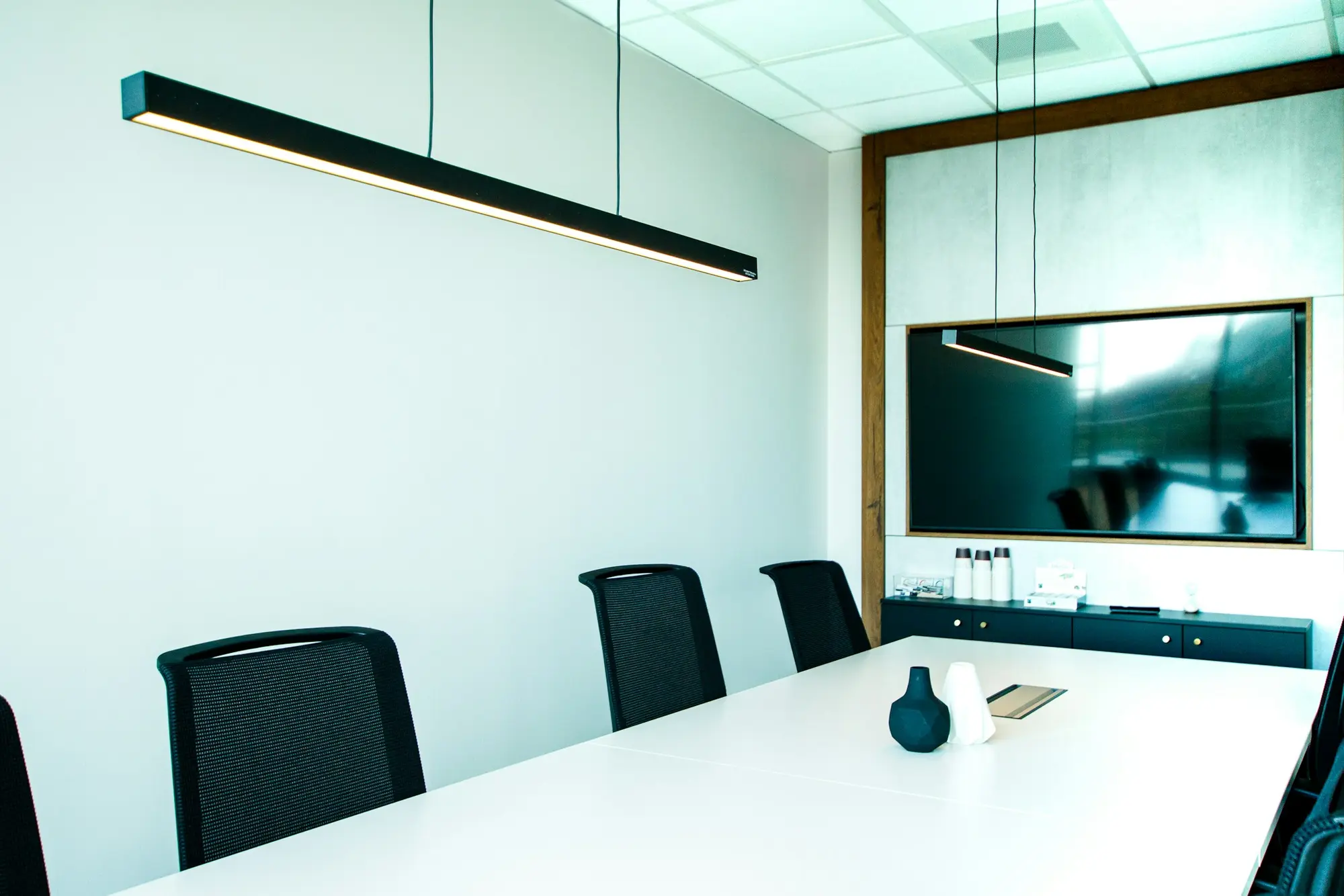 Modern meeting room with a long table (illustrative)