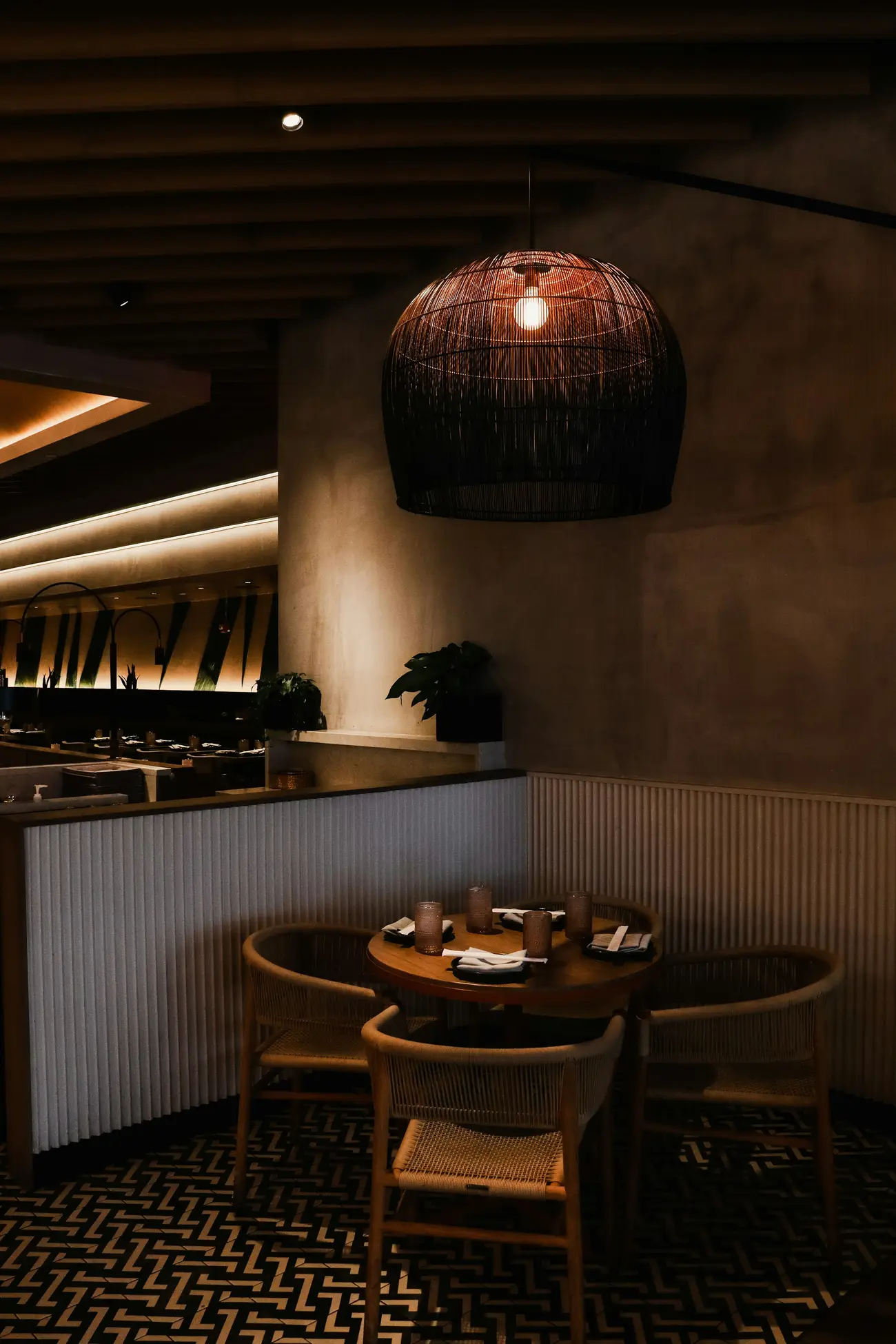 Warmly lit dining room with set tables (illustrative)